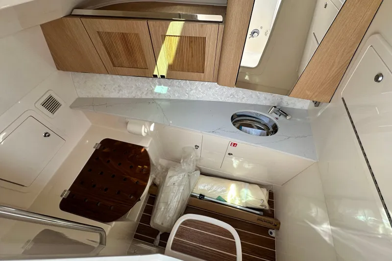 Slide: The Image of 2026 Grady-White Freedom 345 boat interior with modern cabinetry and compact sink. - 43