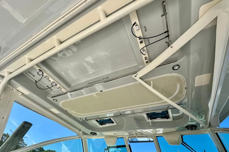 Slide: The Image of 2026 Grady-White Freedom 345 boat interior ceiling with wiring and fixtures. - 48