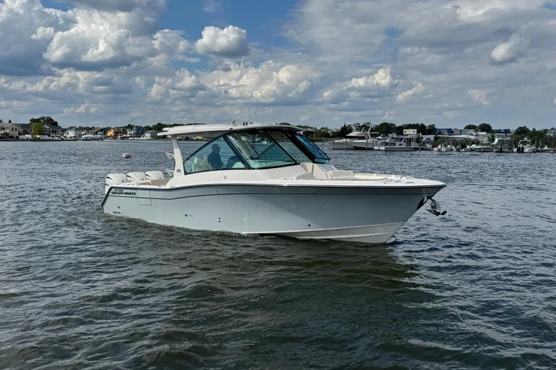 The Image of 2026 Grady-White Freedom 345 boat on calm water under cloudy sky. - 8