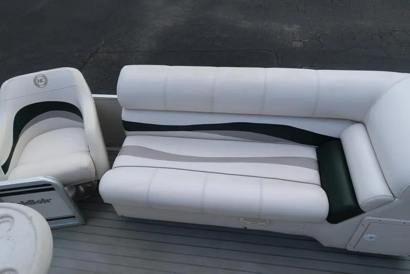 Slide: The Image of 2001 Harris Super Sunliner 240 boat seating with white and green upholstery. - 10