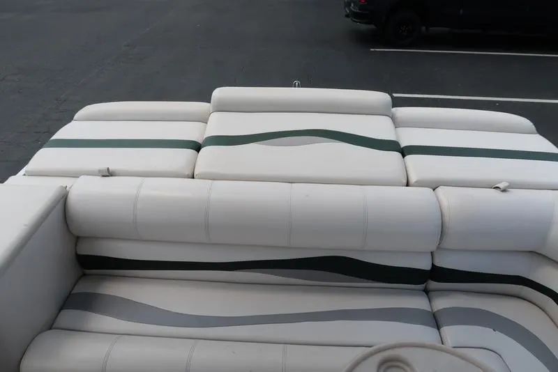 Slide: The Image of 2001 Harris Super Sunliner 240 boat seating with white and green upholstery. - 19