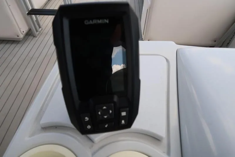 Slide: The Image of Garmin device on 2001 Harris Super Sunliner 240 boat dashboard. - 20