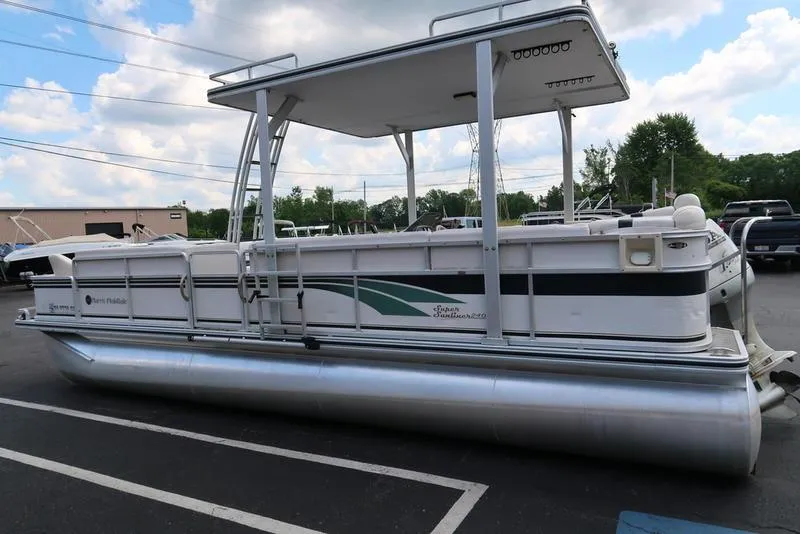 Slide: The Image of 2001 Harris Super Sunliner 240 pontoon boat parked outdoors. - 6