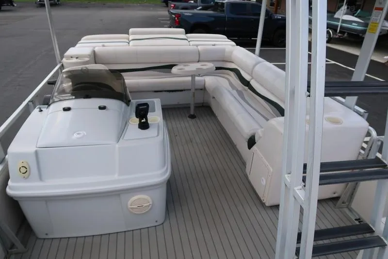 Slide: The Image of 2001 Harris Super Sunliner 240 pontoon boat interior with seating and helm. - 8