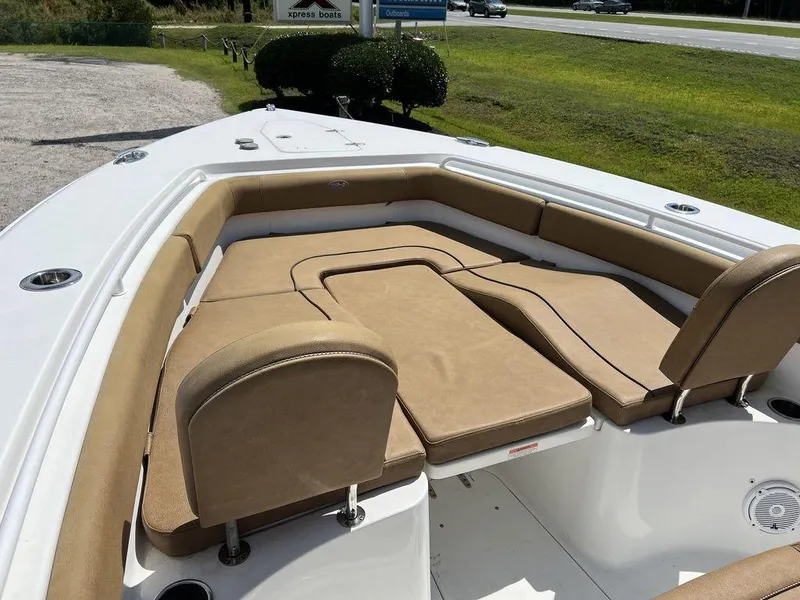 Slide: The Image of 2020 Sea Hunt Ultra 275 SE boat with tan cushioned seating in the bow area. - 5