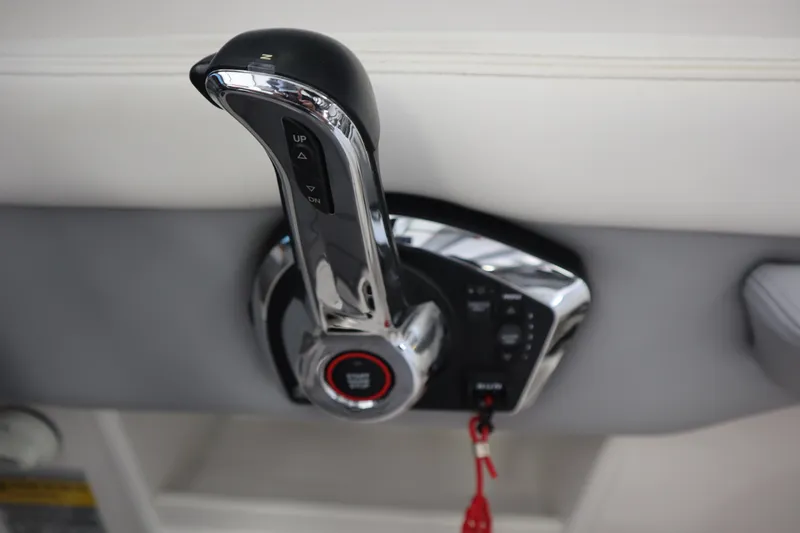 Slide: The Image of Throttle control of 2023 Chaparral 23 Surf boat, featuring sleek chrome design. - 15