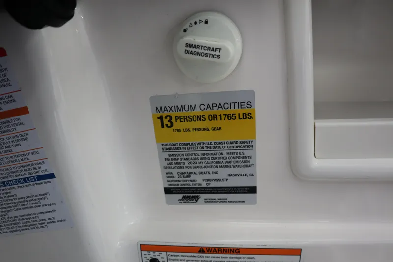 Slide: The Image of 2023 Chaparral 23 Surf boat capacity label, maximum 13 persons or 1765 lbs. - 16