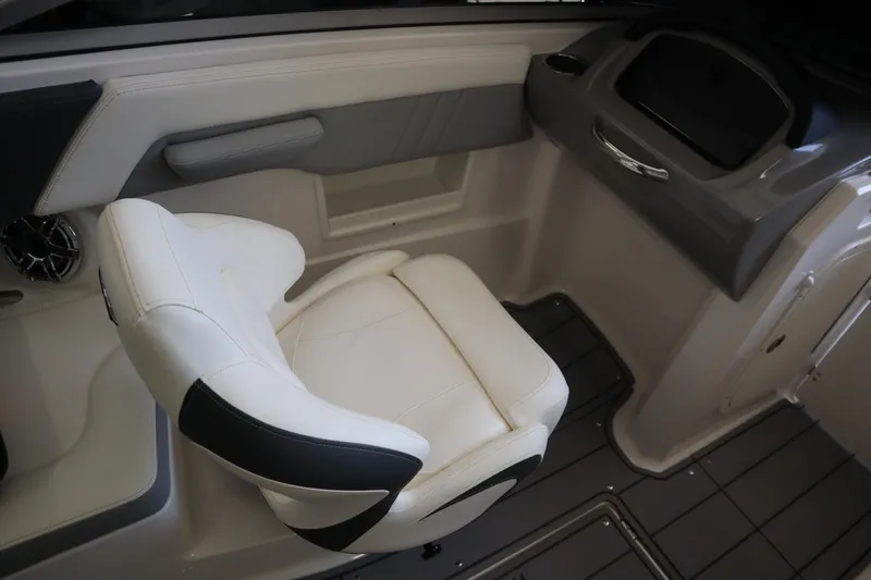 Slide: The Image of 2023 Chaparral 23 Surf boat interior with white and black seating. - 18