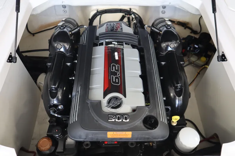 Slide: The Image of Engine compartment of 2023 Chaparral 23 Surf boat, featuring a 6.2L engine. - 28