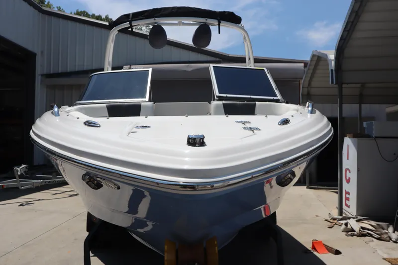 Slide: The Image of 2023 Chaparral 23 Surf boat in a storage facility, front view. - 5