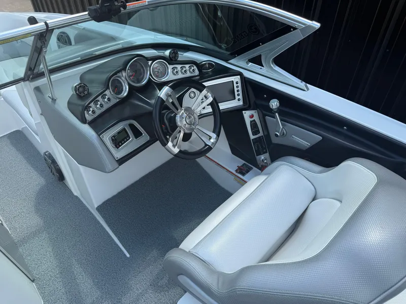 Slide: The Image of 2016 MasterCraft X46 boat interior with sleek dashboard and comfortable seating. - 11