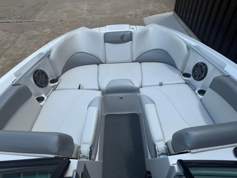 Slide: The Image of Luxurious seating area of 2016 MasterCraft X46 boat with speakers and cup holders. - 12
