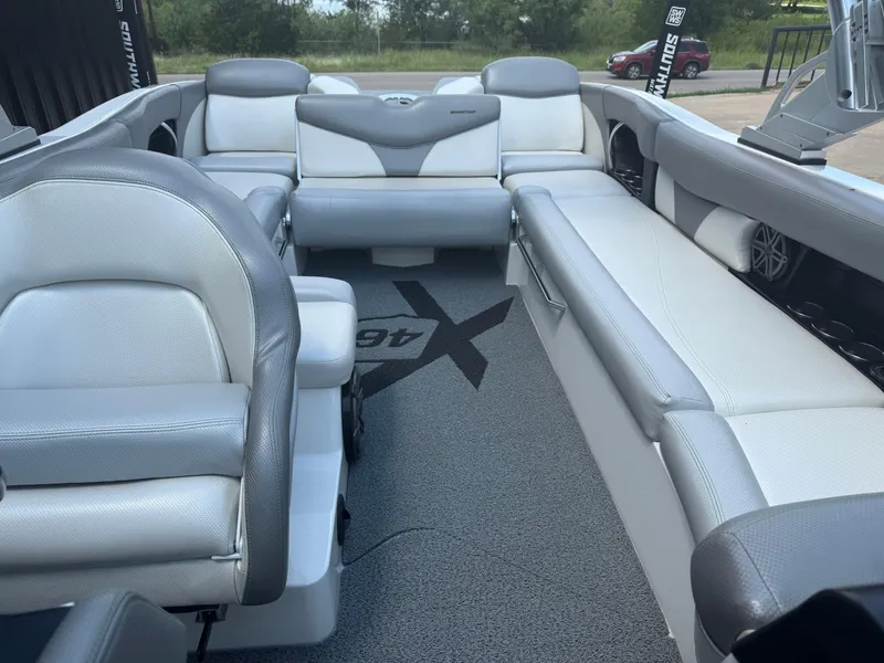 Slide: The Image of 2016 MasterCraft X46 boat interior with gray and white seating. - 13