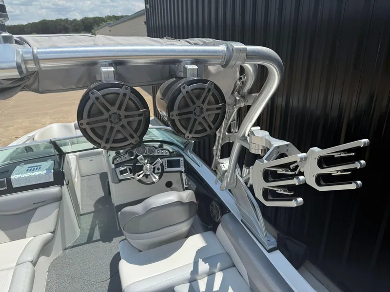 Slide: The Image of 2016 MasterCraft X46 boat interior with speakers and steering wheel, showcasing luxury features. - 6