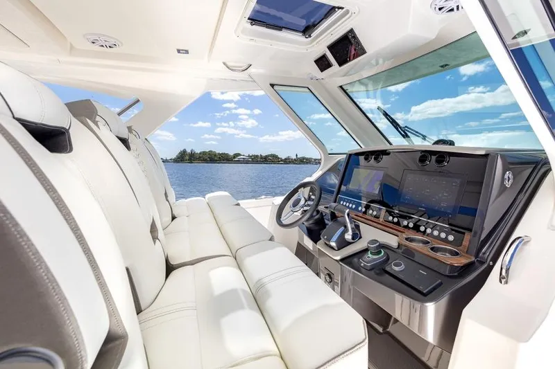 Slide: The Image of 2026 Tiara Yachts 34 LS interior with luxurious seating and sleek design. - 11