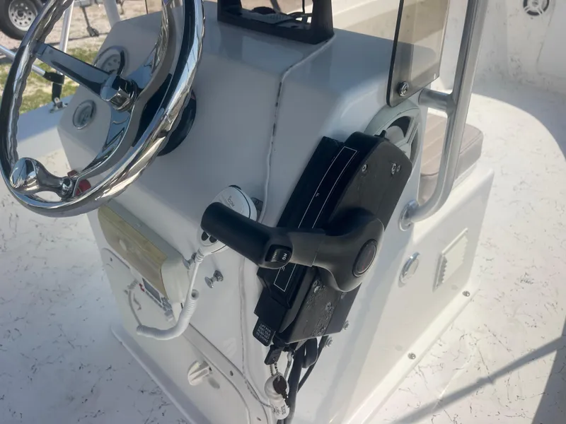 Slide: The Image of Steering console of 2023 Intruder ISLAND CLASSIC 17 boat with chrome wheel and controls. - 19