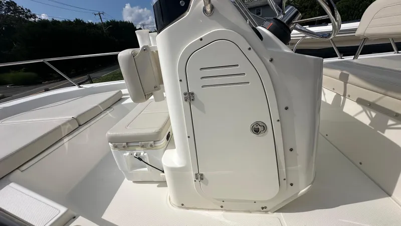 Slide: The Image of 2022 Boston Whaler 150 Montauk boat interior with steering console and seating. - 15