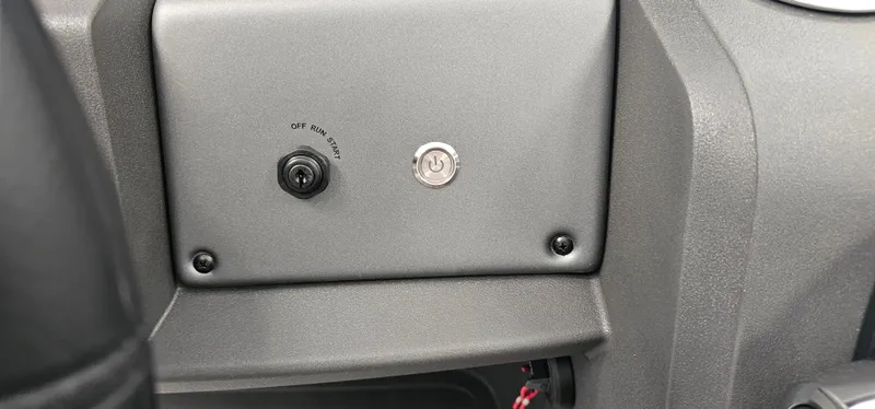 Slide: The Image of Control panel of 2026 Sun Tracker PB-20 with ignition switch and key slot. - 12