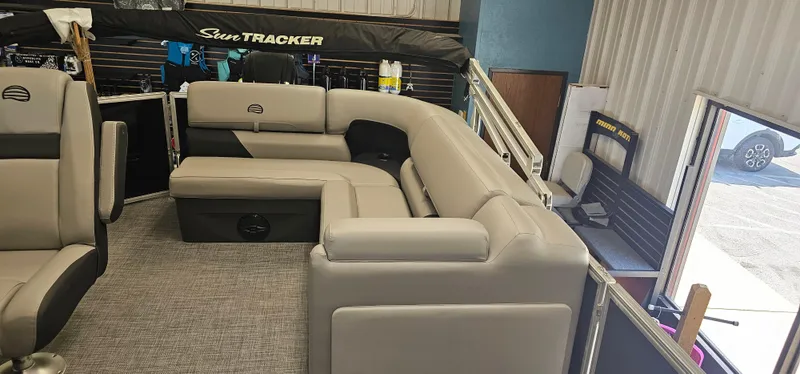 Slide: The Image of 2026 Sun Tracker PB-20 pontoon boat interior with gray seating and modern design. - 13