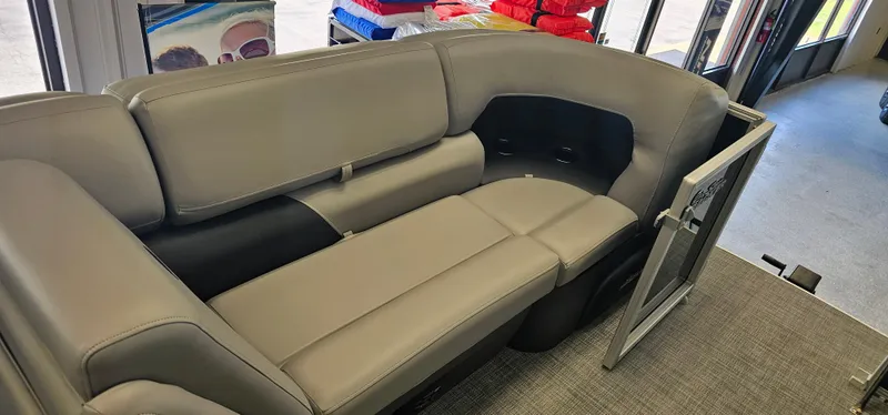 Slide: The Image of 2026 Sun Tracker PB-20 pontoon boat interior with gray seating and open side gate. - 4