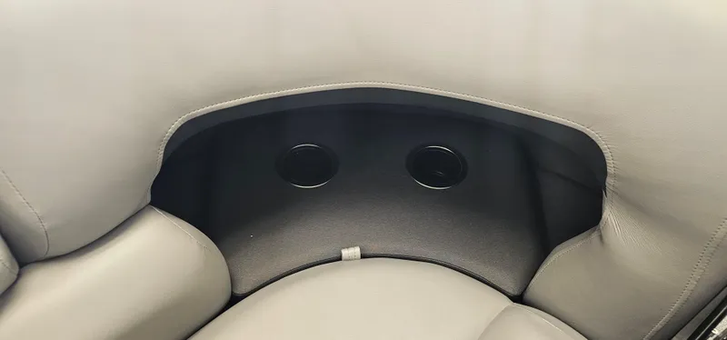 Slide: The Image of Sun Tracker PB-20 2026 boat interior with cup holders and cushioned seating. - 5