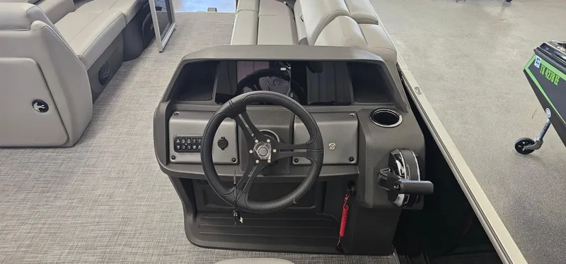 Slide: The Image of 2026 Sun Tracker PB-20 boat dashboard with steering wheel and controls. - 9