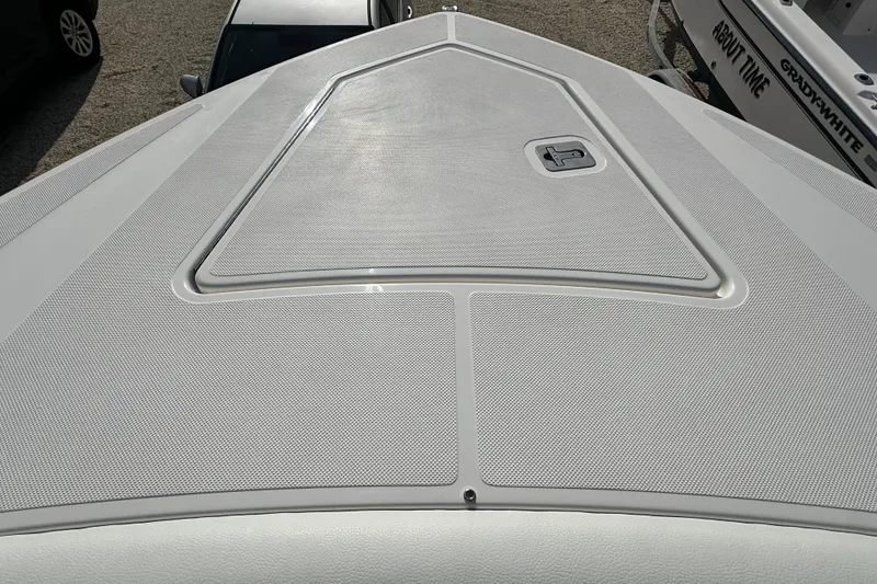 Slide: The Image of Bow view of 2026 Tiara Yachts 34 LS, showcasing sleek design and textured surface. - 23