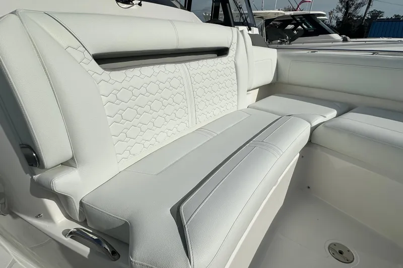 Slide: The Image of Luxurious seating on 2026 Tiara Yachts 34 LS, featuring elegant white upholstery. - 24