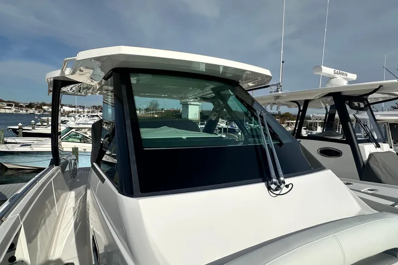 Slide: The Image of 2026 Tiara Yachts 34 LS at marina, showcasing sleek design and modern features. - 25