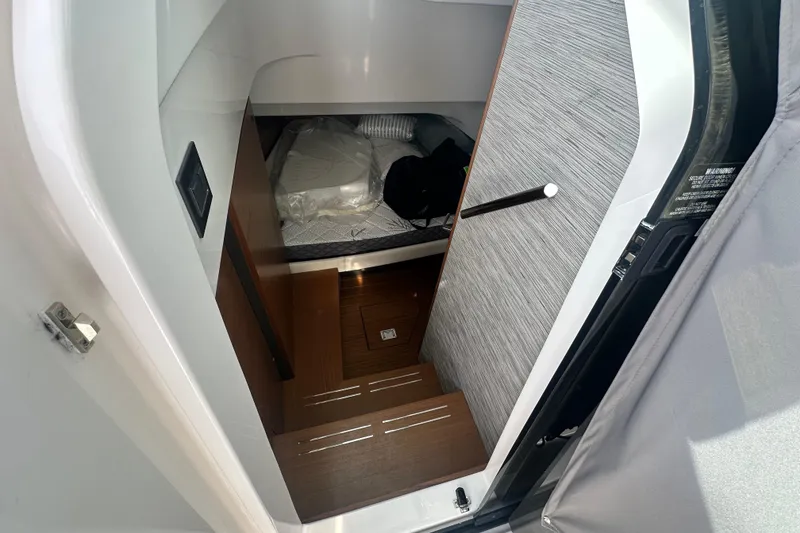 Slide: The Image of Interior cabin of 2026 Tiara Yachts 34 LS, featuring wooden steps and modern design. - 32