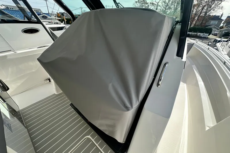 Slide: The Image of 2026 Tiara Yachts 34 LS interior with covered console, sleek design, and modern features. - 38