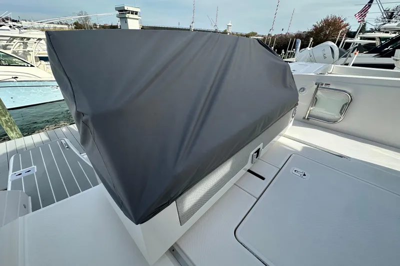 Slide: The Image of 2026 Tiara Yachts 34 LS with covered seating area on deck. - 39
