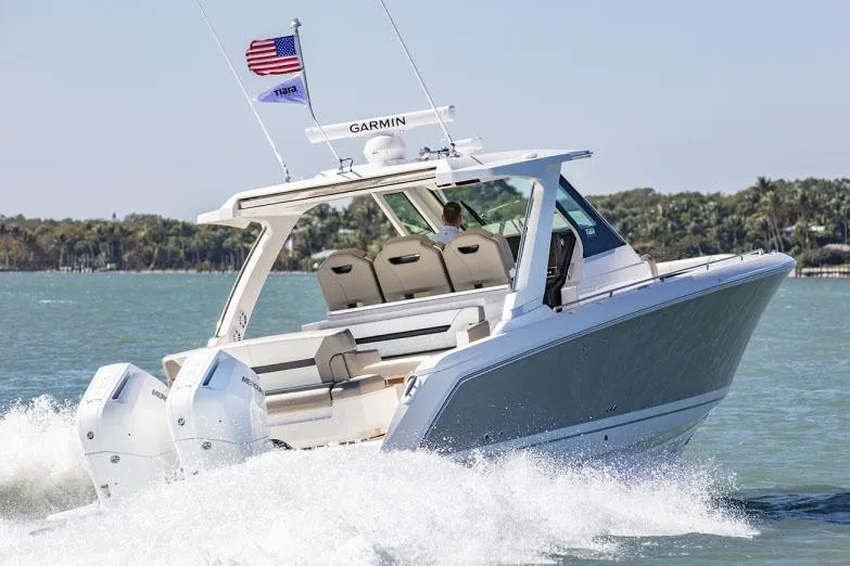 Slide: The Image of 2026 Tiara Yachts 34 LS with Mercury engine, showcasing sleek design and modern features. - 4