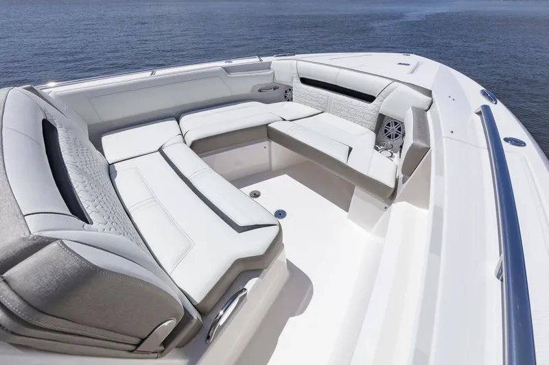 Slide: The Image of 2026 Tiara Yachts 34 LS luxury seating with elegant white upholstery and cup holder. - 8