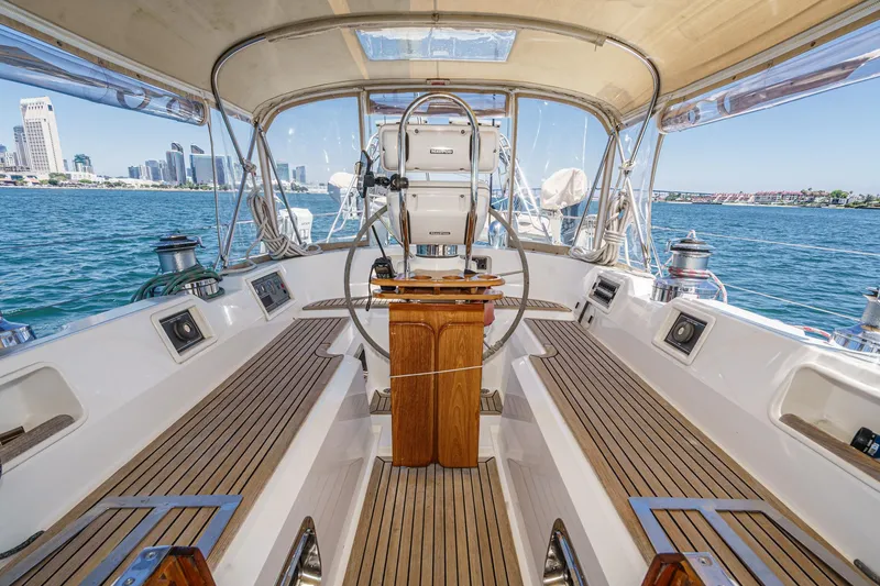 Slide: The Image of Cockpit of 2001 Hylas 49 yacht with city skyline and ocean view. - 14