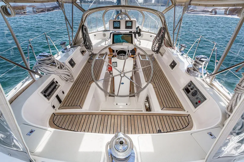 Slide: The Image of Cockpit of 2001 Hylas 49 yacht with steering wheel and navigation equipment. - 15