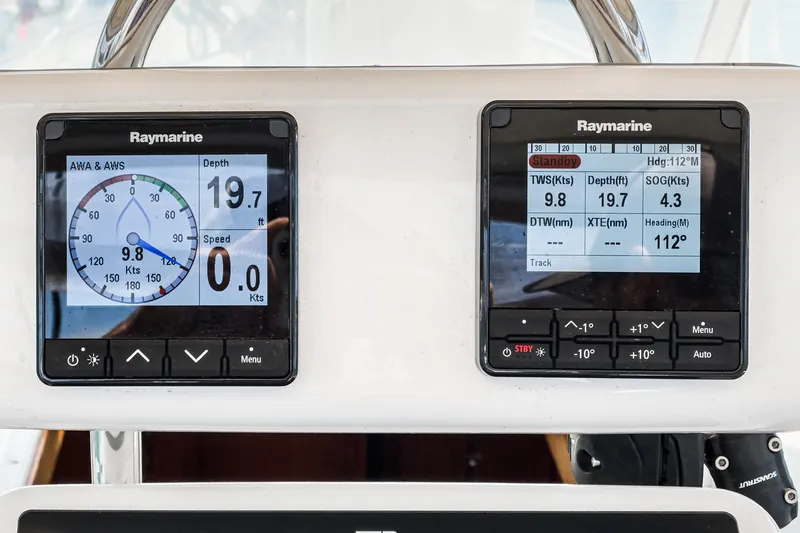Slide: The Image of Raymarine navigation displays on a 2001 Hylas 49 yacht, showing speed, depth, and heading. - 17