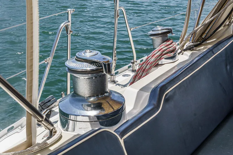 Slide: The Image of Deck of 2001 Hylas 49 sailboat with winches and ropes by the water. - 21