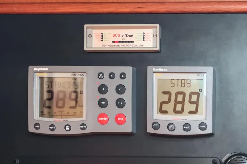 Slide: The Image of Autopilot and navigation displays on a 2001 Hylas 49 yacht, showing standby mode at 289 degrees. - 28