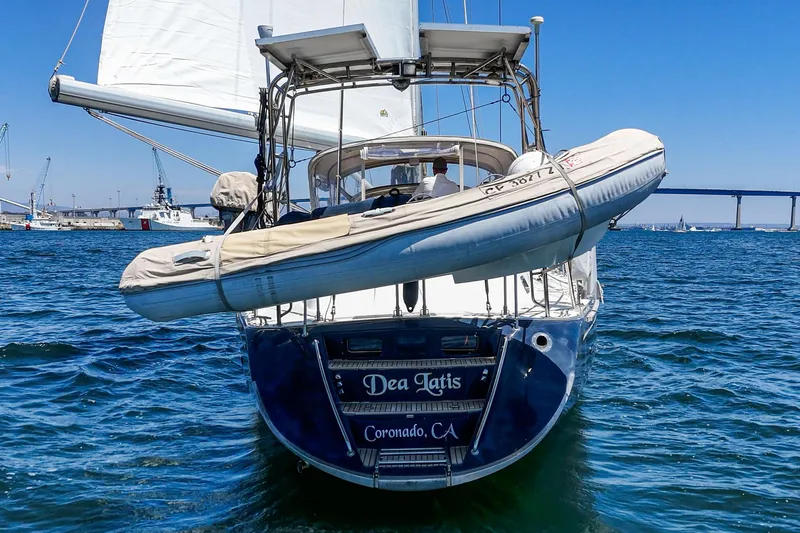 Slide: The Image of Hylas 49 sailboat from 2001 with dinghy, sailing near Coronado, CA. - 6