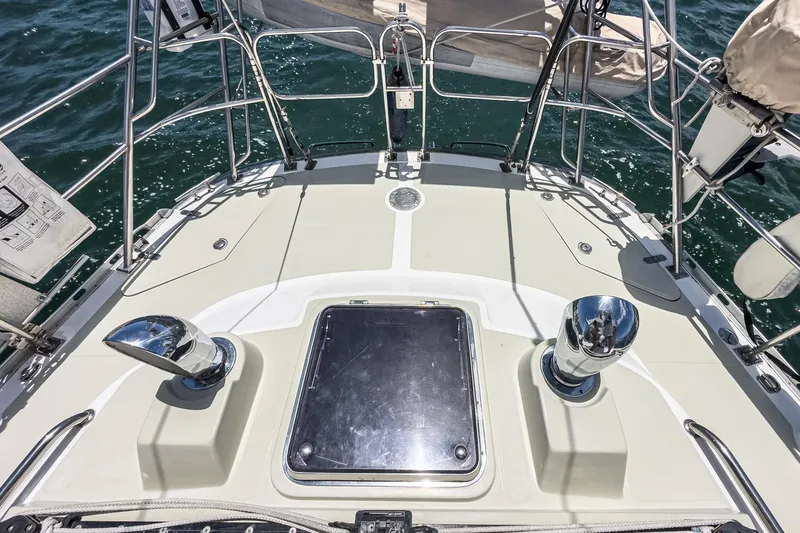 Slide: The Image of Deck of 2001 Hylas 49 sailboat with chrome fittings and ocean view. - 7