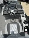 Slide: The Image of 2025 Bennington 25 QSBA boat cockpit with steering wheel and control panel. - 10