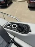 Slide: The Image of 2025 Bennington 25 QSBA boat console with cup holders and controls. - 7