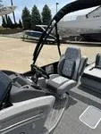 Slide: The Image of 2025 Bennington 25 QSBA boat interior with modern seating and steering console. - 9