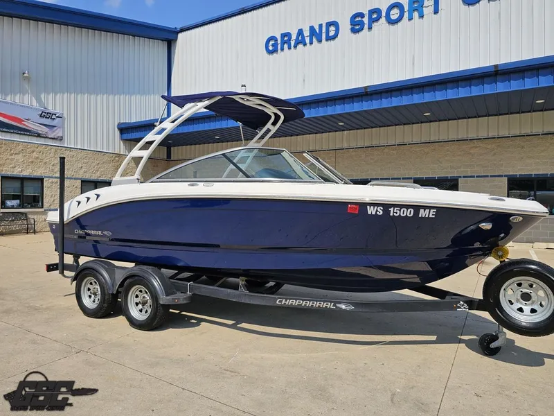 Slide: The Image of 2022 Chaparral 21 SSi boat on trailer outside Grand Sport Center. - 13