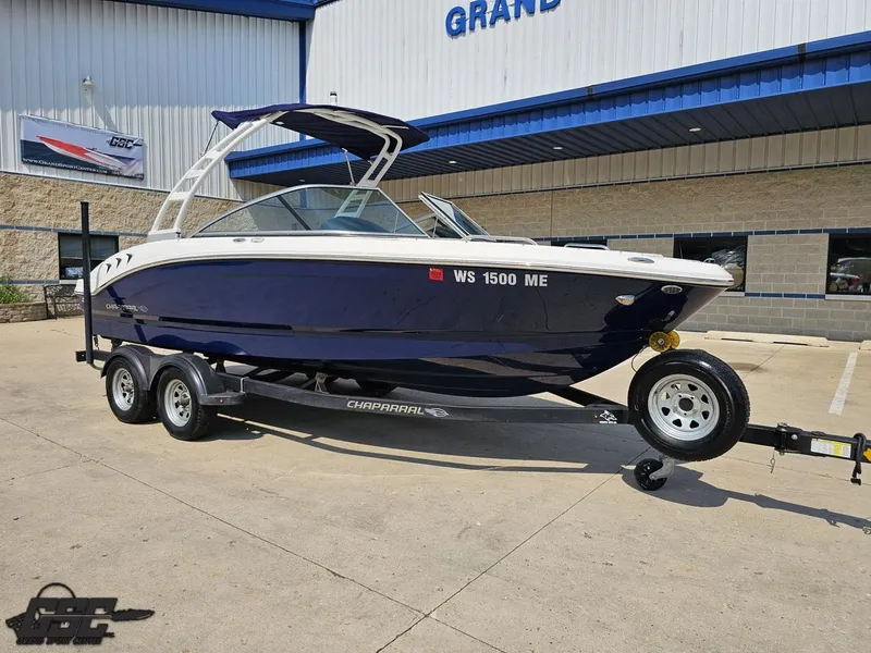 Slide: The Image of 2022 Chaparral 21 SSi boat on trailer outside a dealership. - 14