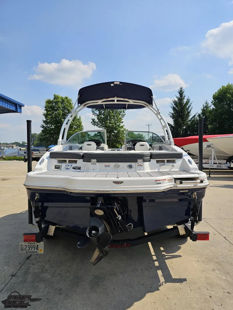 Slide: The Image of 2022 Chaparral 21 SSi boat, rear view, parked outdoors on a sunny day. - 35