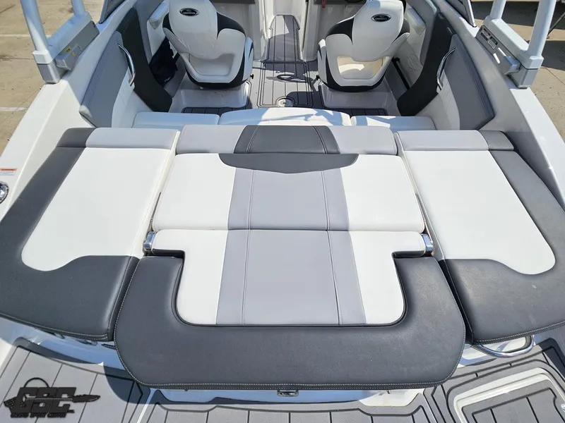 Slide: The Image of 2022 Chaparral 21 SSi boat interior with gray and white seating layout. - 48