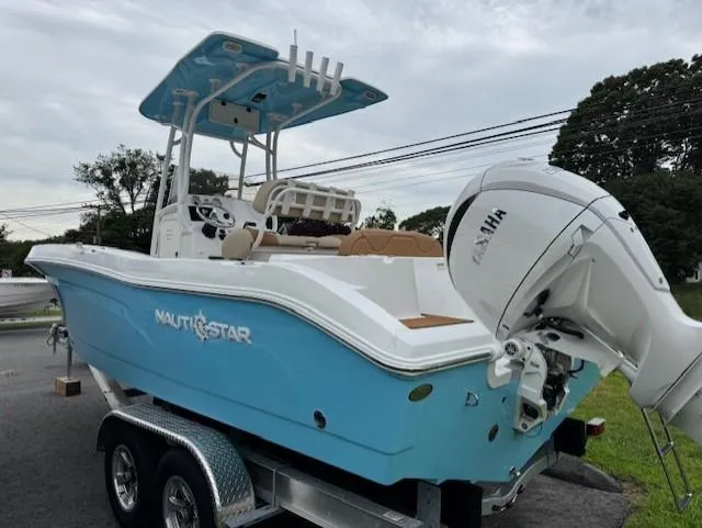 Slide: The Image of 2025 NauticStar 222L Offshore boat on trailer, featuring Yamaha outboard motor. - 4