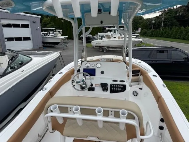 Slide: The Image of 2025 NauticStar 222L Offshore boat interior with modern dashboard and seating. - 5